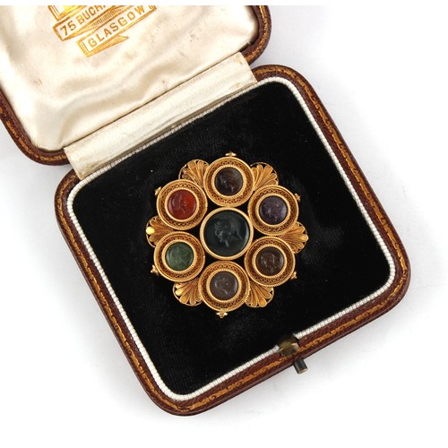 153 - A fine Victorian classical revival unmarked yellow gold (tests 18ct) brooch set with seven variously... 