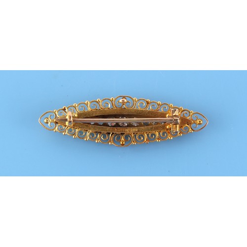 82 - A late 19th / early 20th century 15ct gold & diamond navette shaped brooch with scrollwork border, s... 