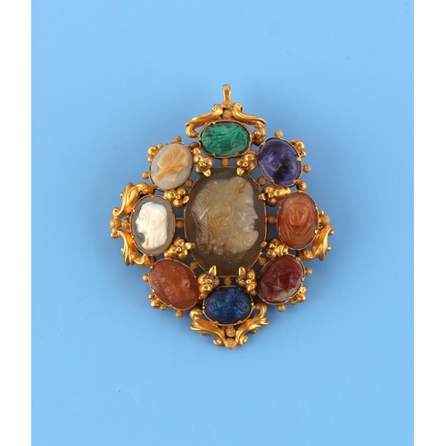 147 - An unmarked yellow gold (tests approximately 15ct) brooch or pendant, set with nine various intaglio... 