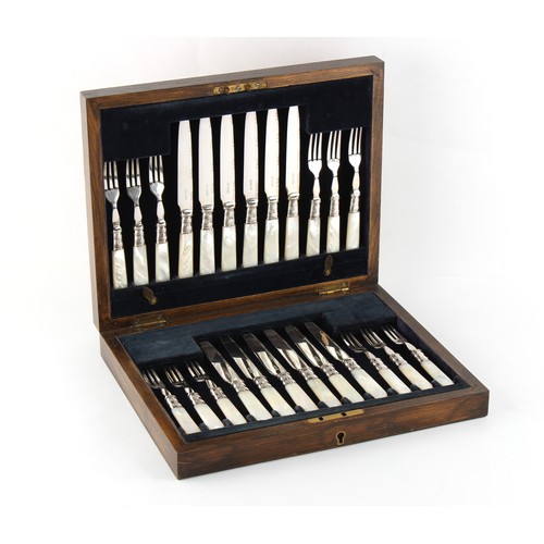 184 - Property of a lady - an oak cased set of twelve each silver plated dessert knives and forks with mot... 