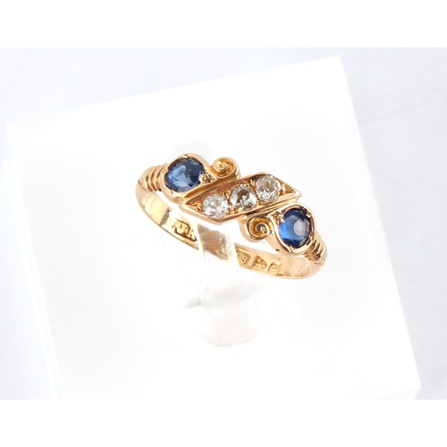 83 - A late Victorian 18ct gold sapphire & diamond ring, with two round cut sapphires flanking a row of t... 