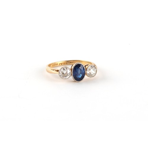 119 - An early 20th century 18ct gold & platinum sapphire & diamond three stone ring, the centre oval cut ... 