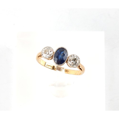 119 - An early 20th century 18ct gold & platinum sapphire & diamond three stone ring, the centre oval cut ... 