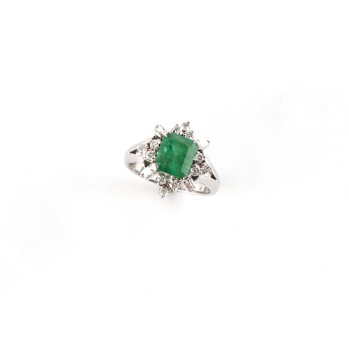 120 - An 18ct white gold emerald and diamond cluster ring, the emerald weighing approximately 2.53 carats,... 