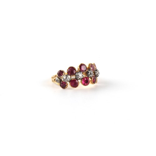 145 - A Georgian ruby & diamond ring, the ten round cut rubies in closed back collets, flanking six diamon... 