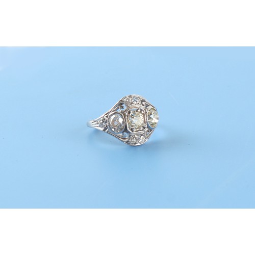 126 - An unmarked white gold diamond ring, the round and oval mixed old cut diamonds weighing an estimated... 