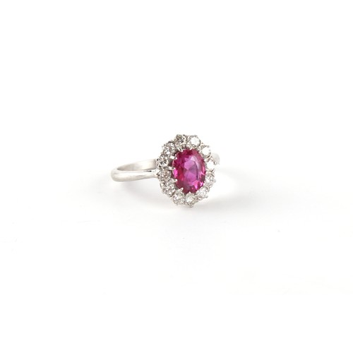 130 - A certificated unheated Burmese (Myanmar) ruby & diamond oval cluster ring, the oval cushion cut rub... 