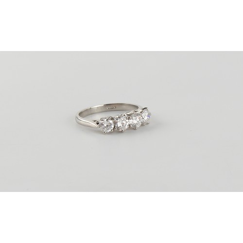 114 - A platinum diamond four stone ring, the round brilliant cut diamonds weighing a total of approximate... 