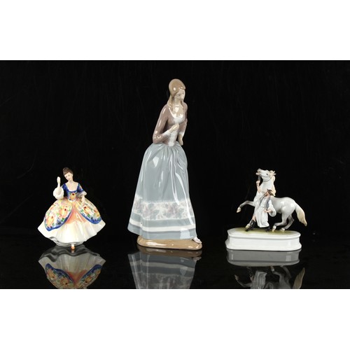 249 - Property of a lady - a large Lladro figure of a girl, 16.8ins. (42.6cms.) high; together with a Here... 