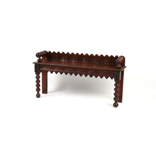 361 - Property of a gentleman - a Victorian carved oak window seat, 47.25ins. (120cms.) long.