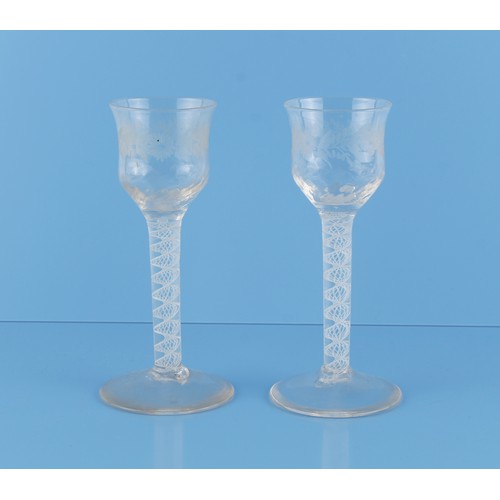 2 - Property of a gentleman - a pair of George III opaque twist cordial glasses, the ogee bowls with eng... 