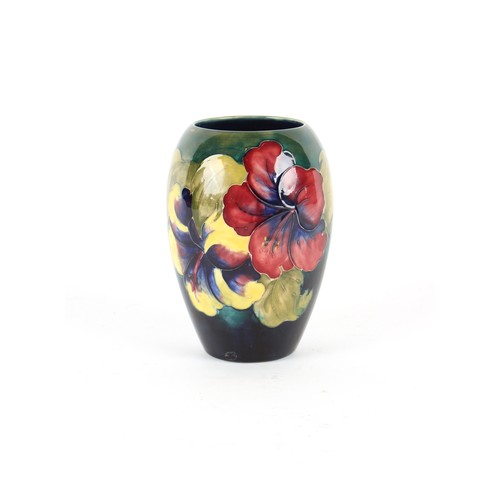 12 - Property of a lady - an early 20th century Moorcroft ovoid pansy vase, 7ins. (17.8cms.) high.