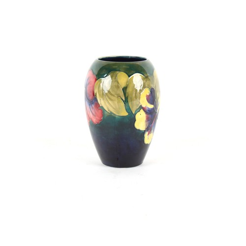 12 - Property of a lady - an early 20th century Moorcroft ovoid pansy vase, 7ins. (17.8cms.) high.