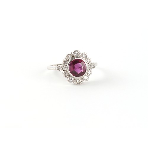 152 - An 18ct white gold ruby & diamond floral cluster ring, the certificated Thai unheated round cut ruby... 