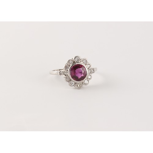 152 - An 18ct white gold ruby & diamond floral cluster ring, the certificated Thai unheated round cut ruby... 