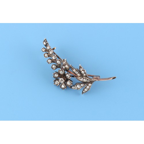 164 - A late Victorian diamond set floral spray brooch, the old cut diamonds weighing a total of approxima... 