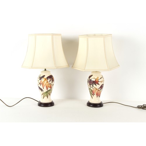 323 - Property of a deceased estate - a pair of Moorcroft Sumac Tree pattern table lamps, each 15ins. (38c... 