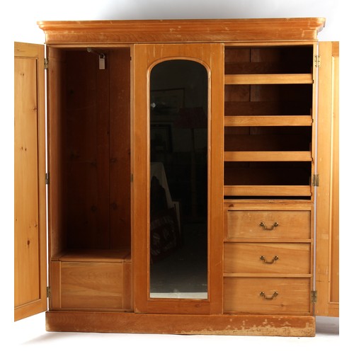 362 - Property of a lady - a Victorian pine triple door compactum or combination wardrobe, enclosing drawe... 