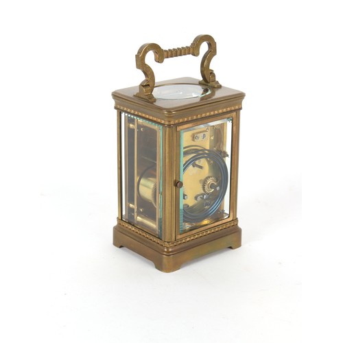 299 - A late 19th century French brass cased carriage clock, striking on a coiled gong, chip to front glas... 