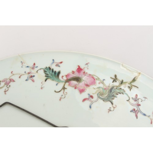 259 - A large Chinese famille rose charger or shallow dish, painted with a large centre landscape and thre... 