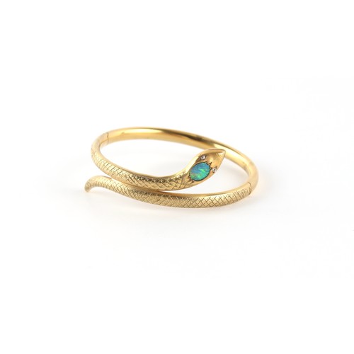 142 - A yellow gold (tests 14/15ct) black opal & diamond snake bangle, hinged, indistinct marks to tongue,... 