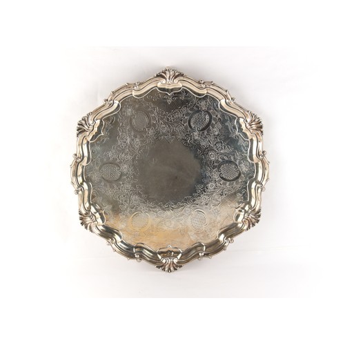 220 - Property of a deceased estate - an Edwardian silver waiter or salver, with scroll feet, Hawksworth E... 