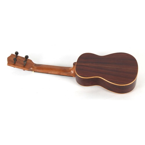 294 - Property of a deceased estate - a Jetel 4-string tenor guitar, 20ins. (51cms.) long, cased.