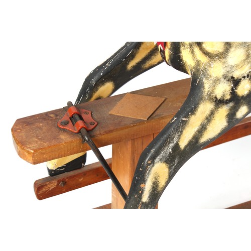 272 - A late 19th / early 20th century carved & painted wooden rocking horse, 59.75ins. (152cms.) long, 54... 