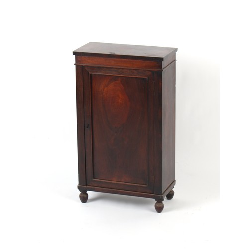 374 - Property of a deceased estate - a small early 19th century rosewood panelled single door cupboard, e... 