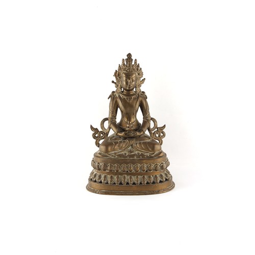 268 - Property of a lady - a Chinese or Tibetan bronze figure of Amitayus Buddha seated on a double lotus ... 