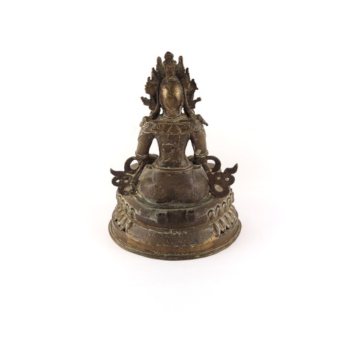 268 - Property of a lady - a Chinese or Tibetan bronze figure of Amitayus Buddha seated on a double lotus ... 