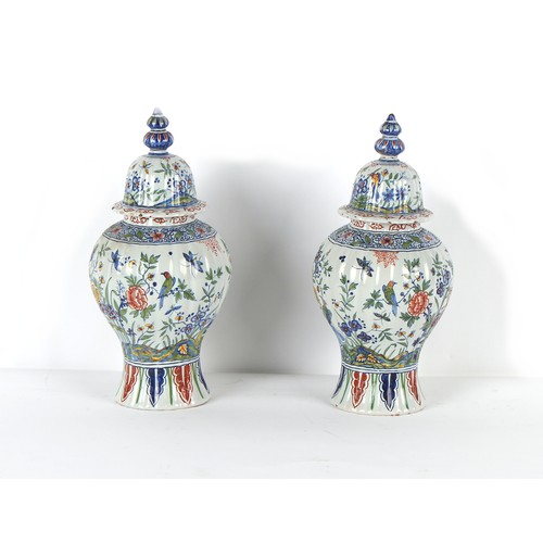 254 - Property of a lady - a pair of Dutch polychrome Delft vases & covers, 19th century, of fluted balust... 