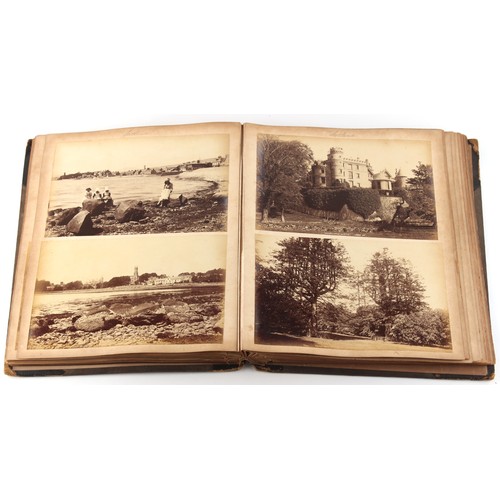 204 - Property of a lady - a Victorian photograph album containing albumen prints, including one of a rock... 