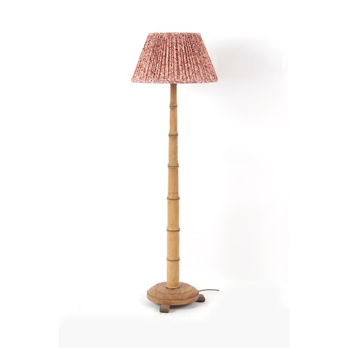 287 - Property of a lady - a faux bamboo standard lamp, with shade, 59ins. (150cms.) high (overall).