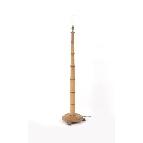 287 - Property of a lady - a faux bamboo standard lamp, with shade, 59ins. (150cms.) high (overall).