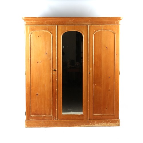 316 - Property of a lady - a Victorian pine triple door compactum or combination wardrobe, enclosing drawe... 