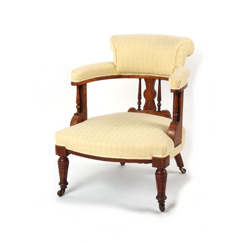 340 - Property of a lady - a Victorian walnut & inlaid tub chair, with pale yellow patterned upholstery.