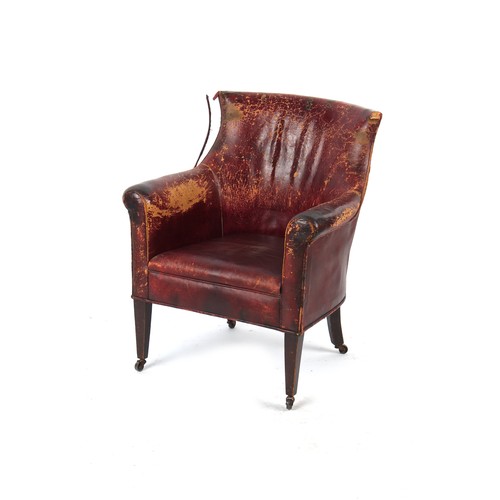 341 - Property of a lady - an early 20th century dark red leather upholstered library armchair or tub chai... 