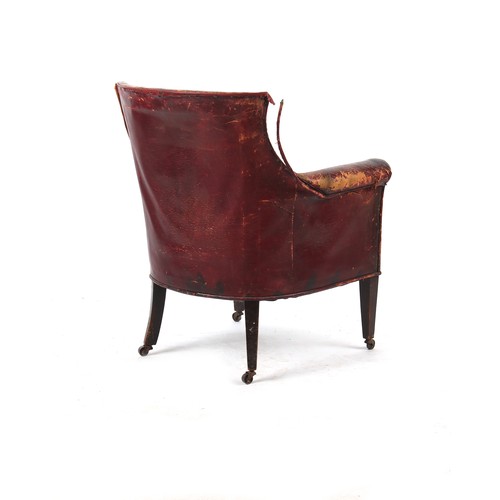 341 - Property of a lady - an early 20th century dark red leather upholstered library armchair or tub chai... 