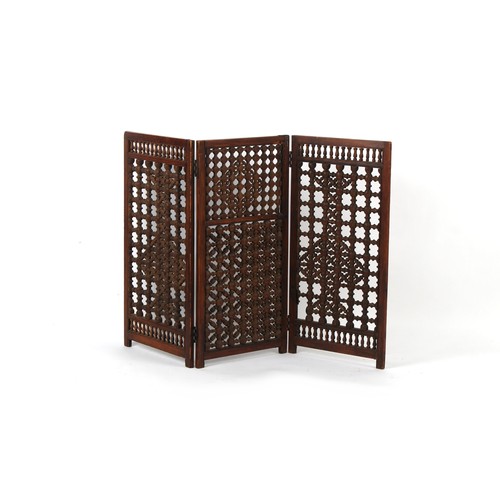 363 - Property of a deceased estate - an Indian turned hardwood three fold screen, 38.2ins. (97cms.) high.