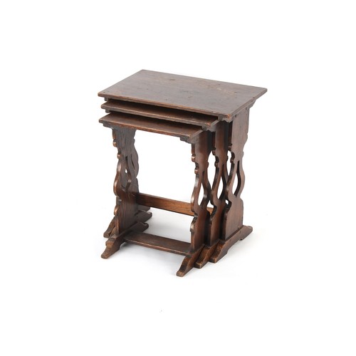 398 - Property of a deceased estate - a nest of three reproduction oak occasional tables, the largest 18in... 