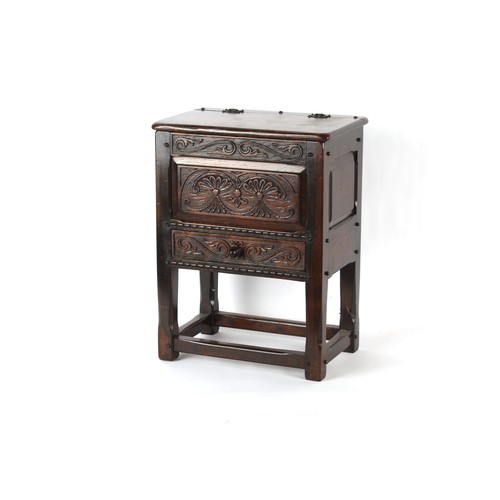 399 - Property of a deceased estate - a reproduction carved oak box stool with hinged top & drawer under, ... 