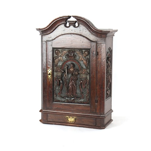 403 - Property of a deceased estate - an 18th century Continental carved oak wall cabinet enclosing divisi... 