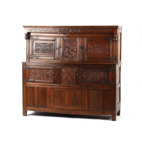 404 - Property of a deceased estate - a late 17th century carved oak court cupboard, dated 1685, 69ins. (1... 