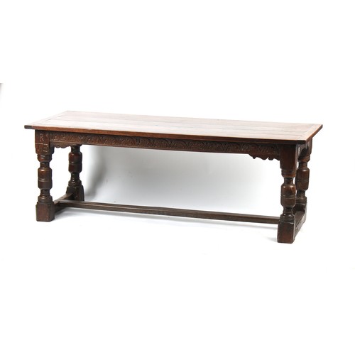 408 - Property of a deceased estate - an oak refectory table with cleated top & carved lunette frieze to o... 