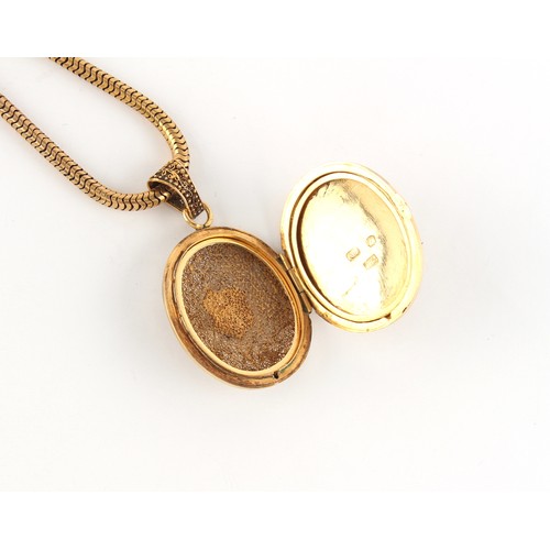 61 - Property of a gentleman - a Chinese 18ct yellow gold oval locket pendant with filigree Phoenix decor... 