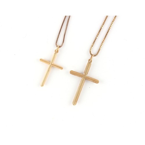 30 - Property of a gentleman - two 9ct yellow gold cross pendants on 9ct gold chain necklaces, the larger... 