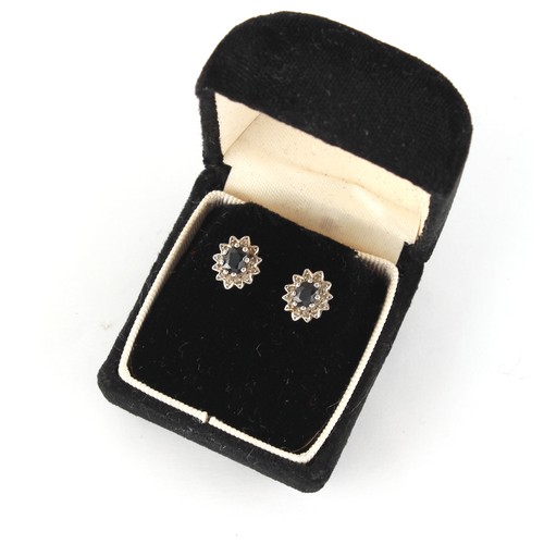 23 - Property of a gentleman - a pair of sapphire & diamond oval cluster earrings, each head approximatel... 