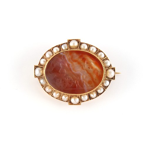 65 - A Victorian unmarked gold (tested) carved agate & pearl oval brooch, the agate depicting a winged fi... 