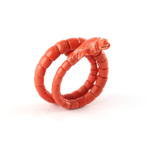 51 - A carved coral snake bracelet, approximately 37.8 grams.